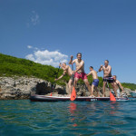 Team Building activity in the form of a giant stand up paddleboard race