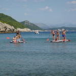 Giant SUP Team race on beach teambuilding